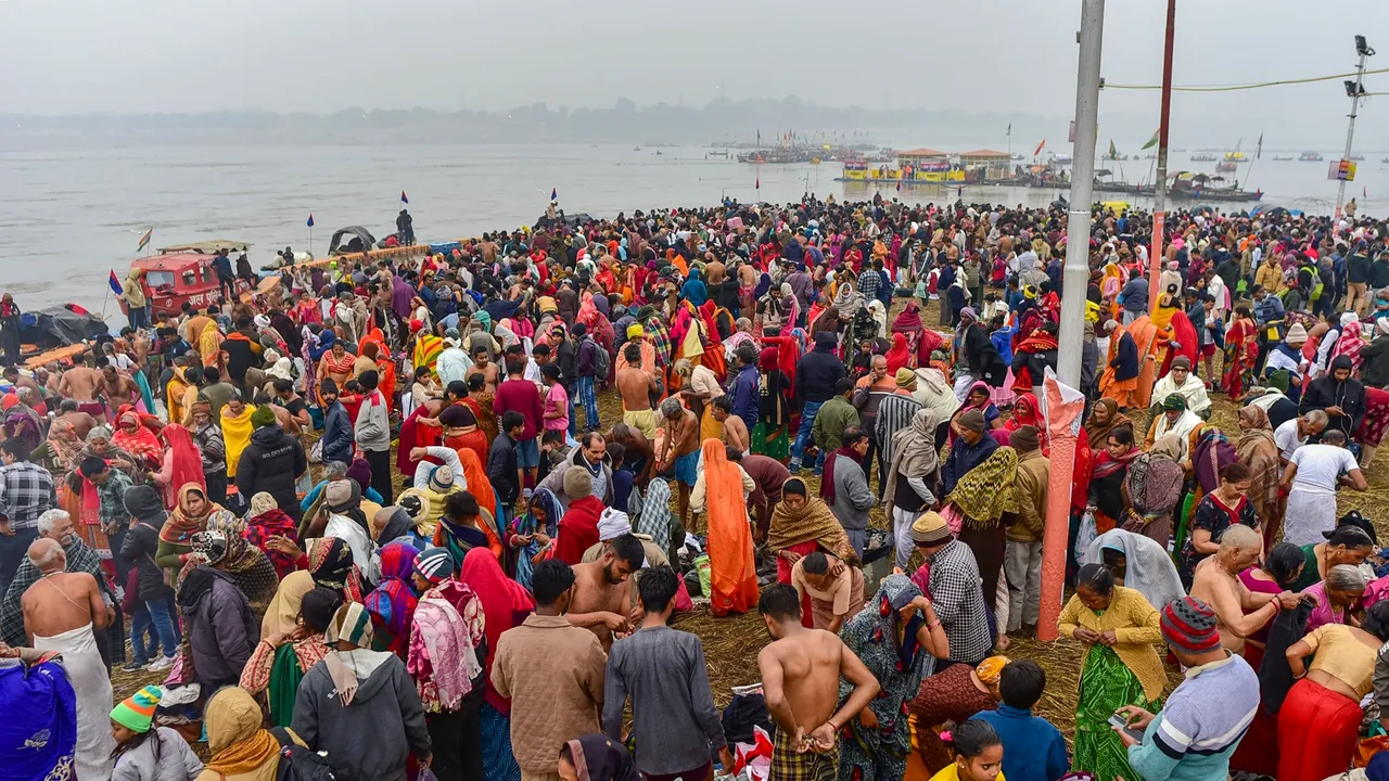 Devotees gather to take holy dip in the Ganga river on the occasion of Makar Sankranti festival, in Prayagraj