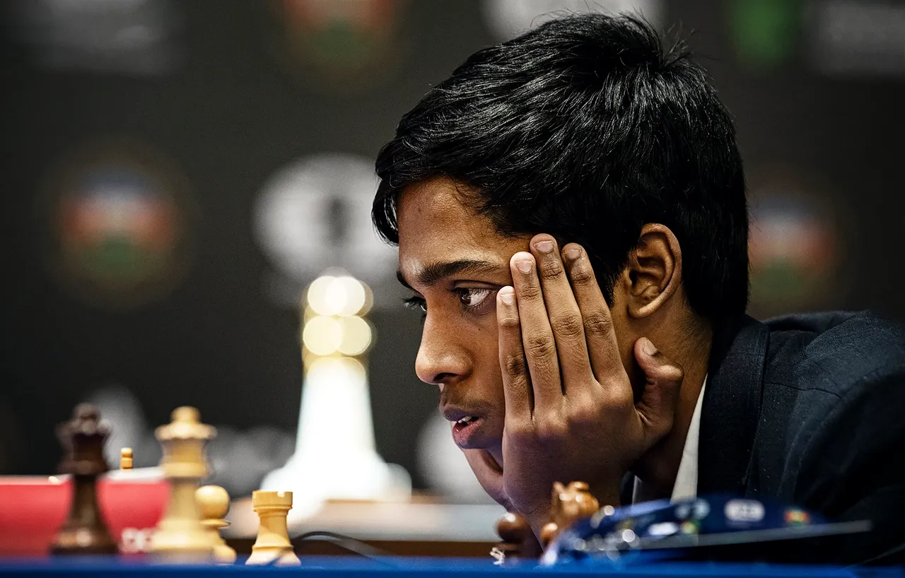 Indian Grandmaster R Praggnanandhaa and during the first game of the Chess World Cup 2023 final against Norway's Grandmaster and World No. 1 player Magnus Carlsen, in Baku