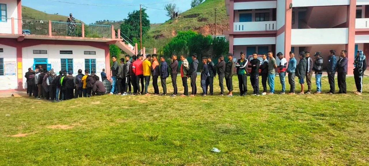 Voters wait in a long queue to cast their votes for Sohiong Assembly seat by-election, in East Khasi Hills district of Meghalaya