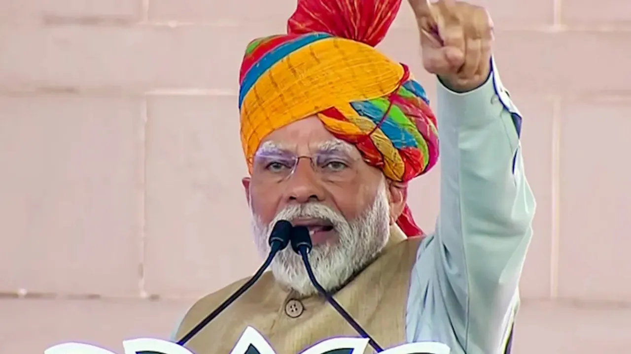 Prime Minister Narendra Modi speaks during a public meeting ahead of Rajasthan Assembly elections, in Kotri