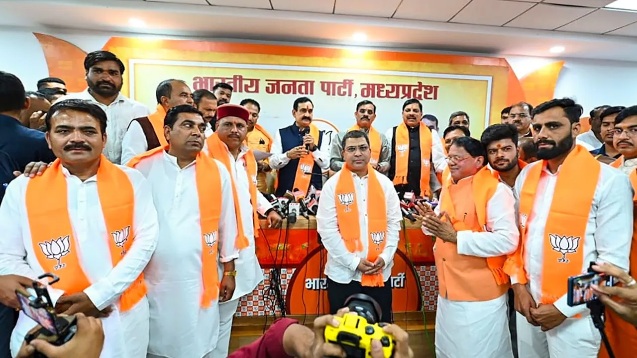 Madhya Pradesh Chief Minister Mohan Yadav and BJP MP President VD Sharma with newly-joined party leaders, in Bhopal