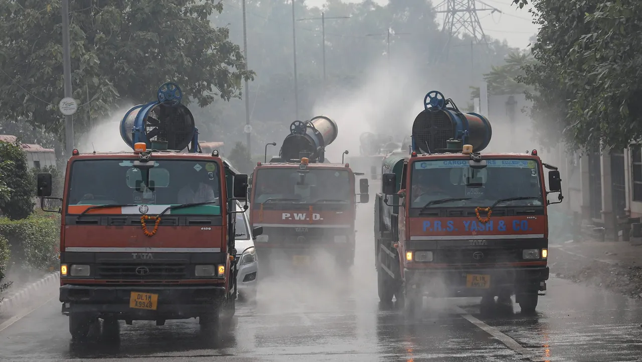 Mobile anti-smog guns spray water to curb air pollution after their flag-off by Delhi Environment Minister Gopal Rai, at Delhi Secretariat, in New Delhi