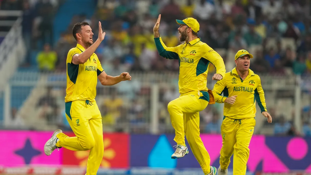 Australia's bowler Josh Hazlewood celebrates the wicket of South Africa's batter Rassie van der Dussen during the ICC Men's Cricket World Cup 2023 semi-final match