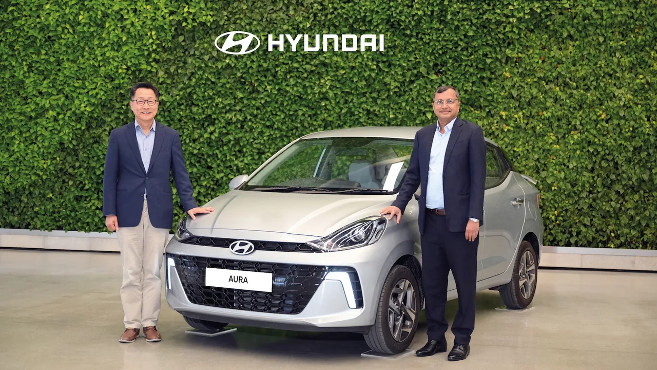 Unsoo Kim – MD & CEO, HMIL and Tarun Garg – COO (Sales, Marketing, Service & Product Strategy, HMIL at the launch of new Hyundai Aura