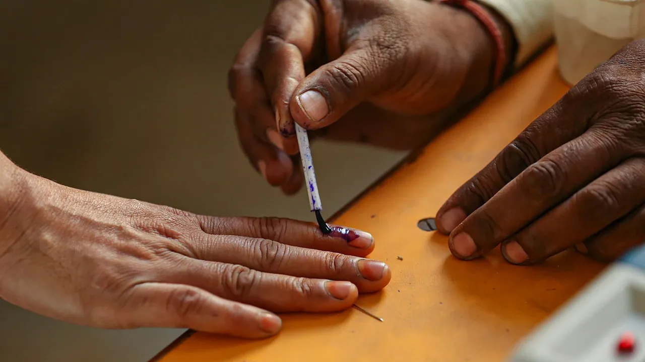 A voter gets his finger marked with indelible ink during voting for the second phase of Lok Sabha elections, in Mathura, Friday, April 26, 2024