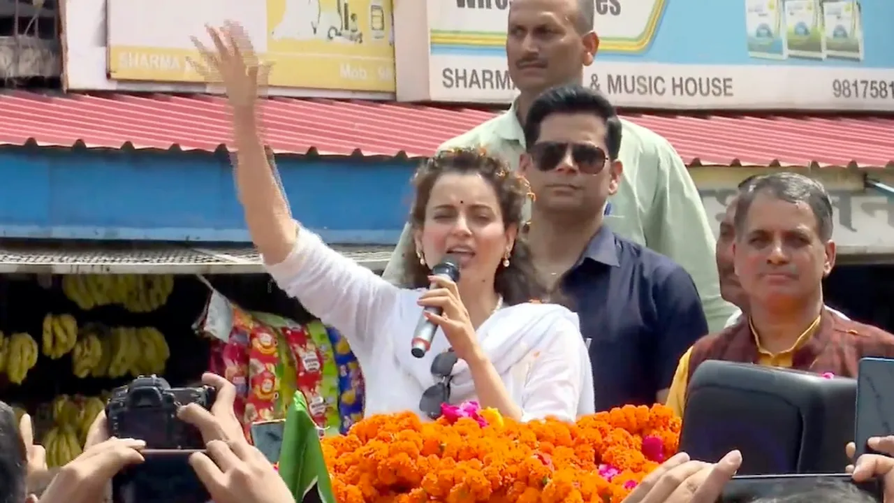 BJP candidate actor Kangana Ranaut addresses supporters during a roadshow ahead of Lok Sabha elections, in Mandi, on March 29, 2024.