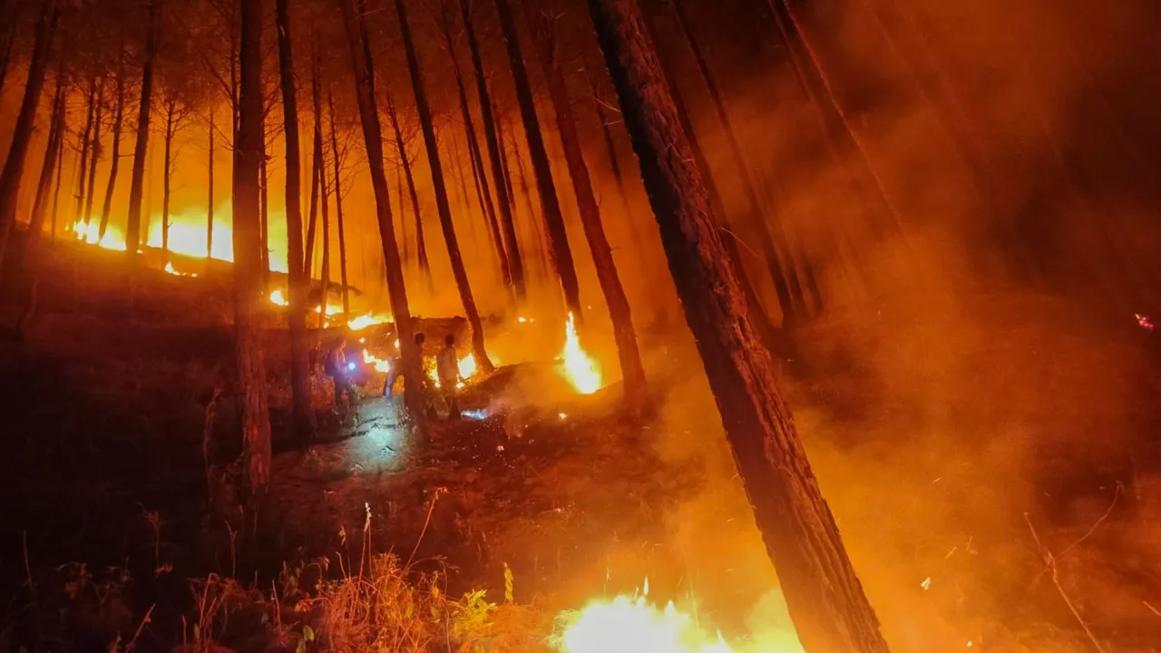 Smoke rises from a forest fire, in Uttarkashi district, Wednesday, May 29, 2024