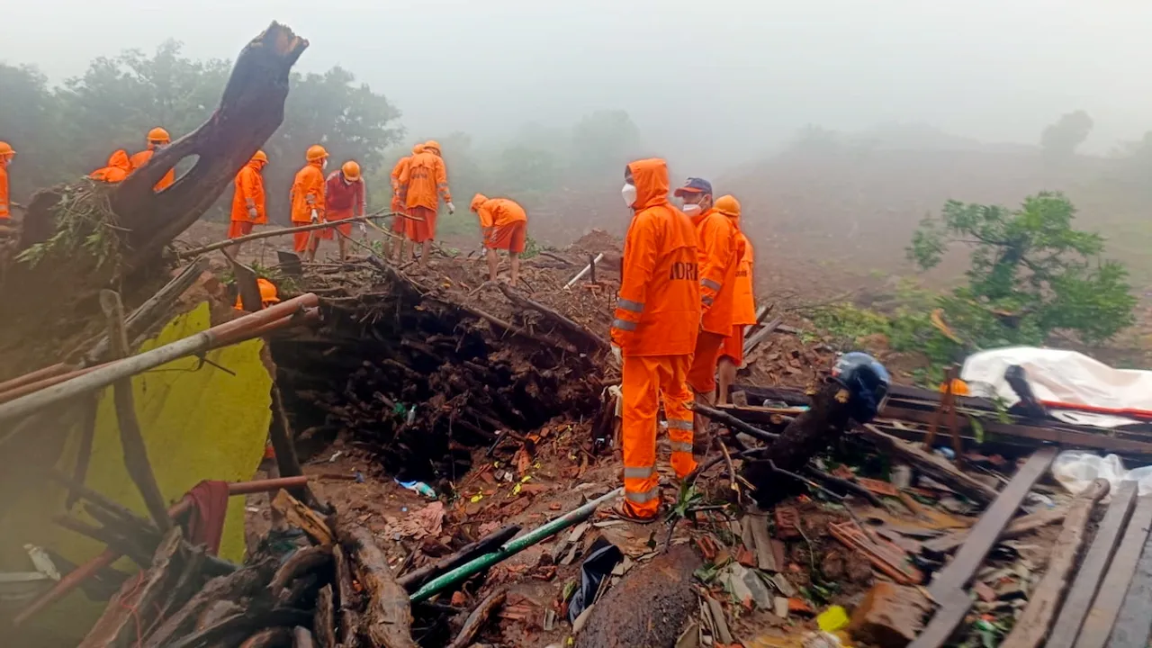 NDRF personnel during a search and rescue operation after a landslide at Irshalwadi village in Raigad district on July 22