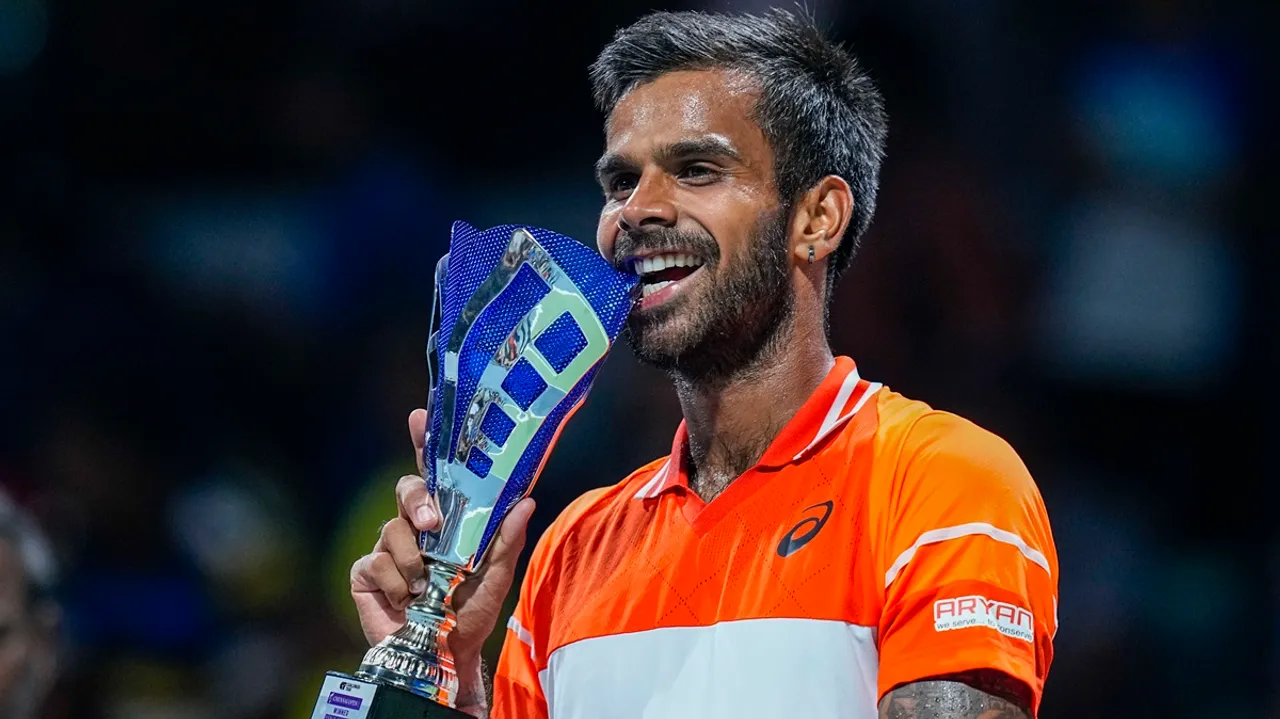 India's Sumit Nagal poses with the trophy during the presentation ceremony after winning the singles event at the ATP Challenger Chennai Open 2024 tennis tournament, in Chennai, Sunday, Feb. 11, 2024.