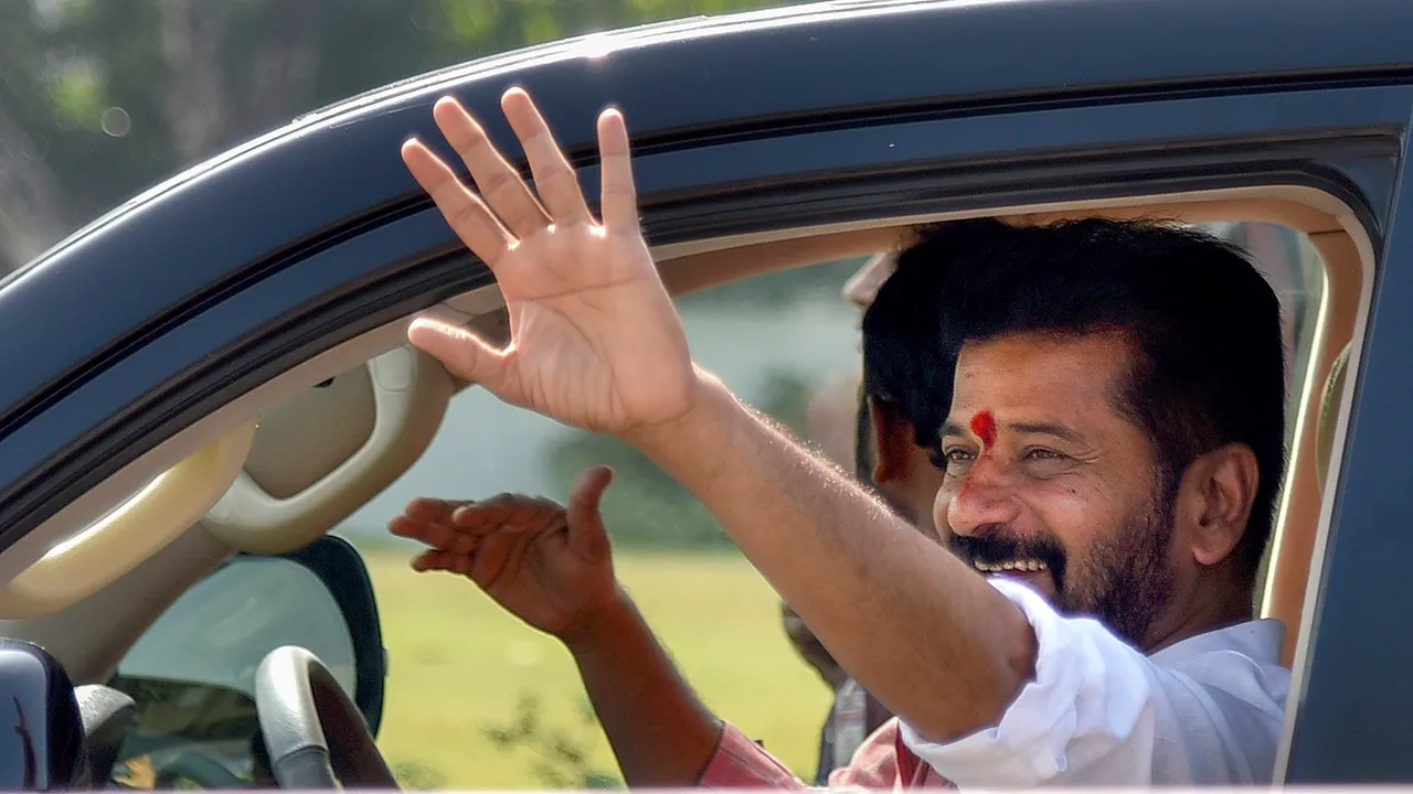 Telangana Chief Minister A Revanth Reddy waves from his car during 'Praja Darbar', at Praja Bhavan in Hyderabad