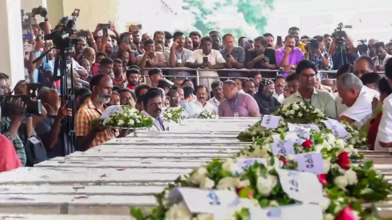 Kerala Chief Minister Pinarayi Vijayan lays a wreath on the mortal remains of the Indians who died in the tragic fire incident in Kuwait two days ago, at Cochin International Airport, Friday, June 14, 2024.