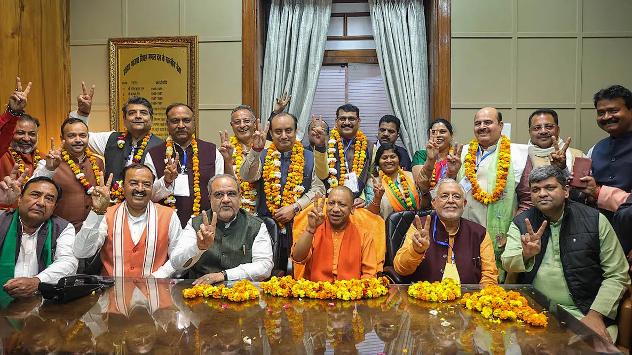 Uttar Pradesh Chief Minister Yogi Adityanath, Deputy Chief Minister Keshav Prasad Maurya and other leaders with the BJP candidates who have been elected as Rajya Sabha MPs in the the recently-held polls, in Lucknow, Tuesday,