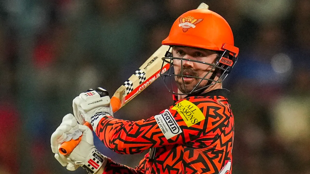 Travis Head plays a shot during the Indian Premier League (IPL) 2024 cricket match between Royal Challengers Bengaluru and Sunrisers Hyderabad, at M Chinnaswamy stadium in Bengaluru, Monday, April 15, 2024.