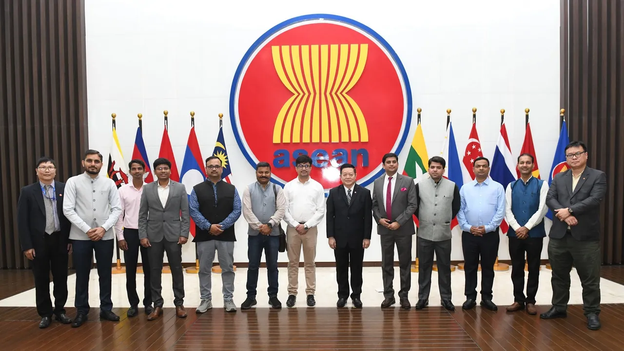 ASEAN Secretary-General Kao Kim Hourn poses for photos with a delegation of Indian media, in Jakarta, Indonesia