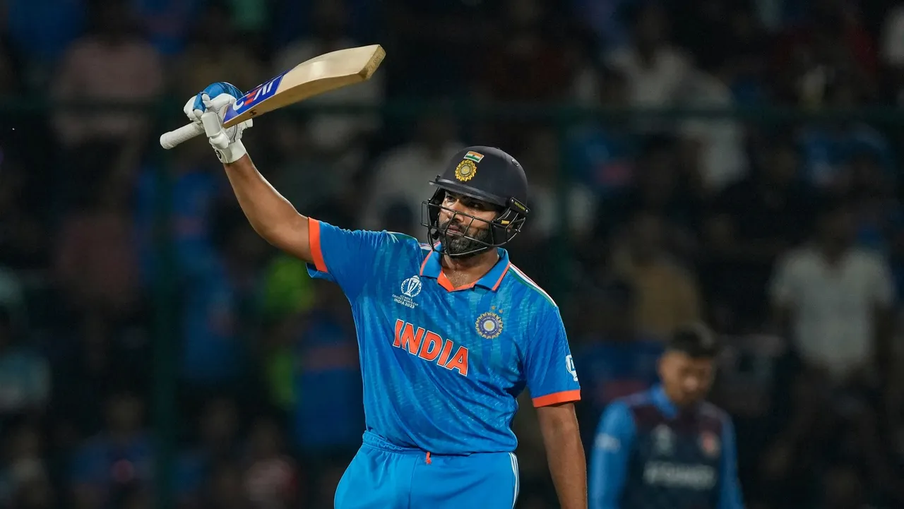 India's captain Rohit Sharma celebrates his century during the ICC Men's Cricket World Cup 2023 match between India and Afghanistan