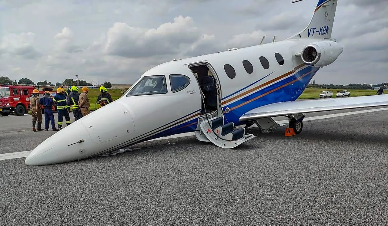A private aircraft after it made an emergency landing due to a technical snag with its nose landing gear, at Hindustan Aeronautics Limited (HAL) airport in Bengaluru