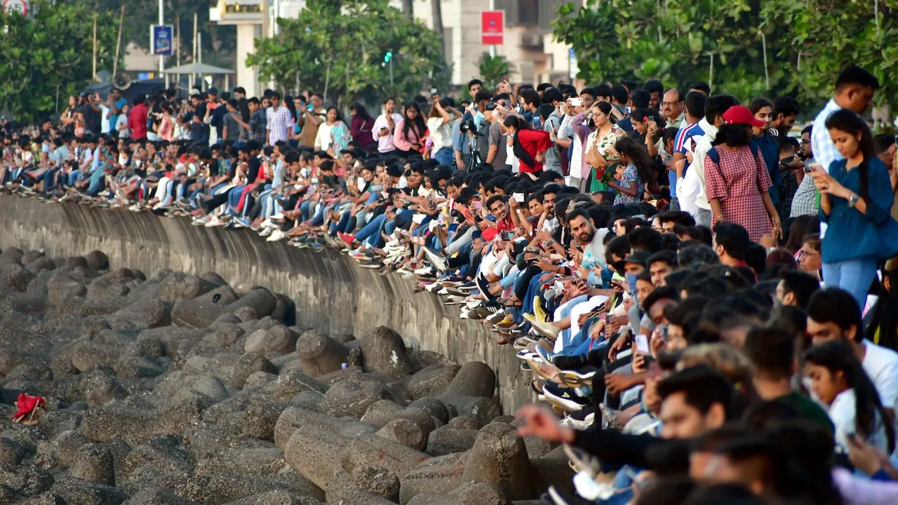 People enjoy on the eve of New Year, at Marine Drive in Mumbai, Saturday
