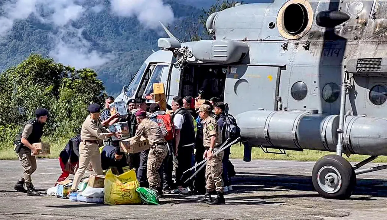 Tourists evacuated from flood-affected Lachen by helicopter arrive at Ringhim Helipad, Mangan in North Sikkim
