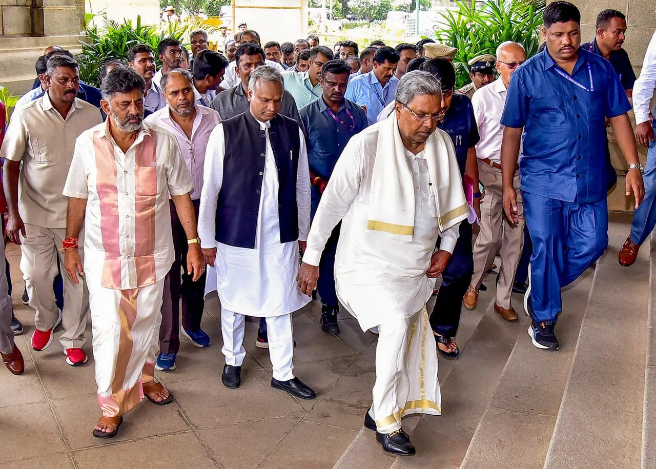 Newly sworn-in Karnataka Chief Minister Siddaramaiah and Deputy Chief Minister D K Shivakumar arrive at Vidhana Soudha, in Bengaluru