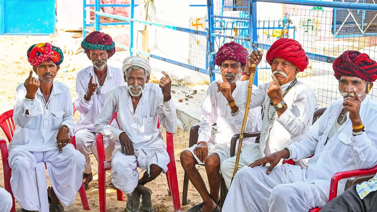 People show their ink-marked fingers after casting their votes for the second phase of Lok Sabha elections, in Ajmer, Friday, April 26, 2024.