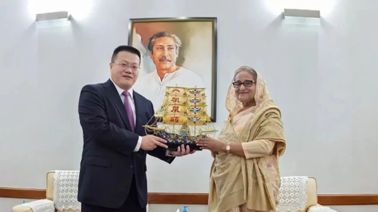 The image shows Chinese Ambassador Yao Wen gifting a boat to Prime Minister Sheikh Hasina on Monday at the official residence Ganabhaban, January 8, 2023