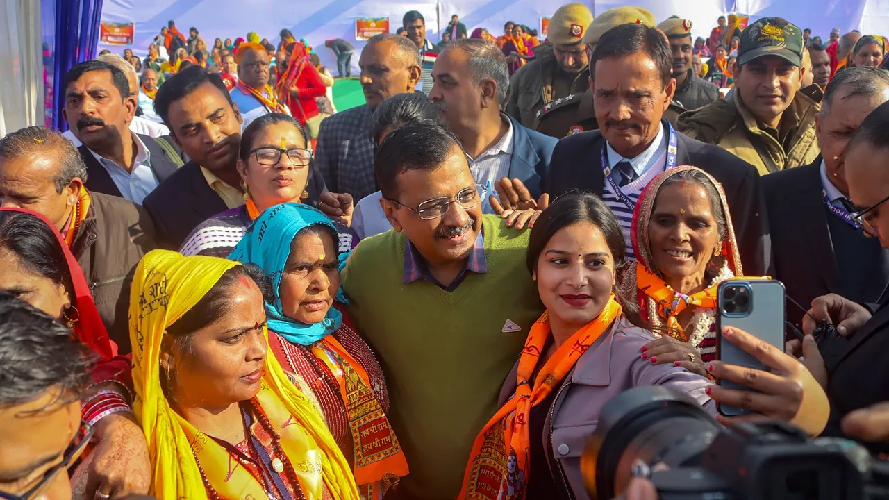 Delhi Chief Minister Arvind Kejriwal poses for photos at a programme under the 'Chief Minister Pilgrimage Scheme', at the Thyagraj Stadium in New Delhi