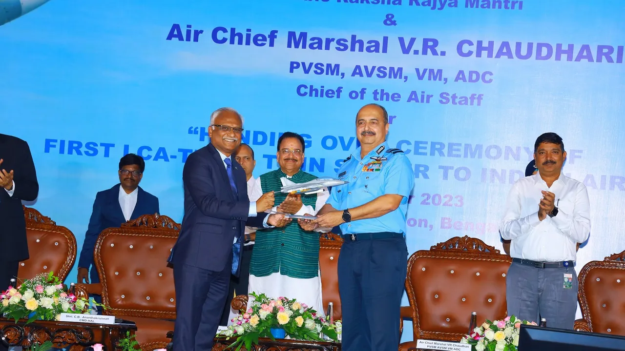 Indian Air Force chief Air Chief Marshal VR Chaudhari receives the LCA Tejas twin-seater trainer aircraft from Hindustan Aeronautics Limited CMD CB Ananthakrishnan in Bengaluru