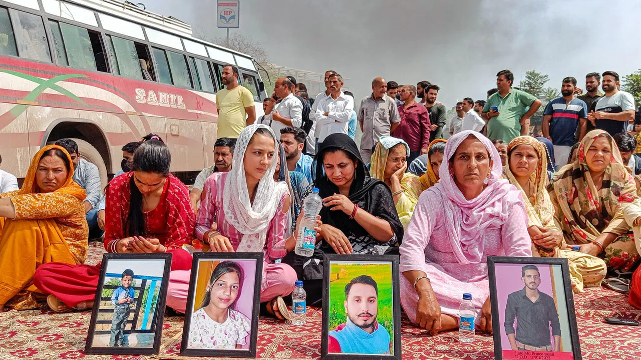 Families of Dhangri terror attack victims block the Jammu-Rajouri-Poonch National Highway during their protest demanding justice, at Muradpur Chowk in Rajouri
