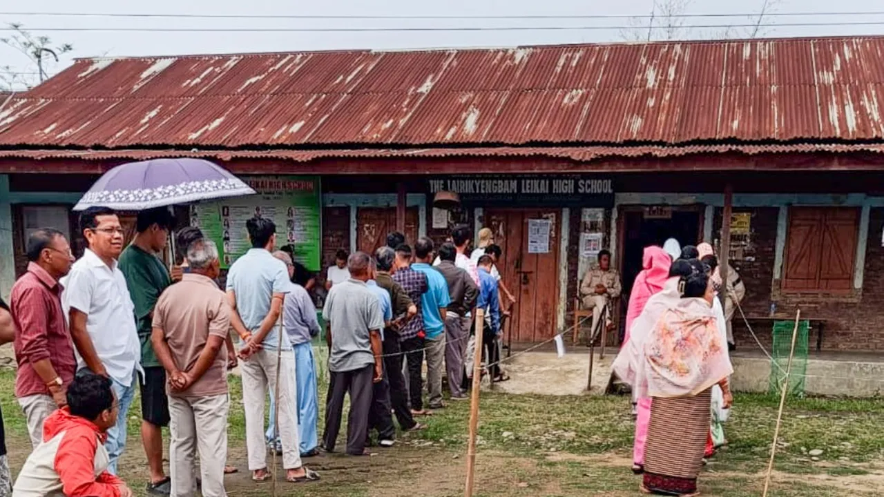 People wait to cast their votes for Lok Sabha elections, in Manipur, Friday, April 19, 2024.