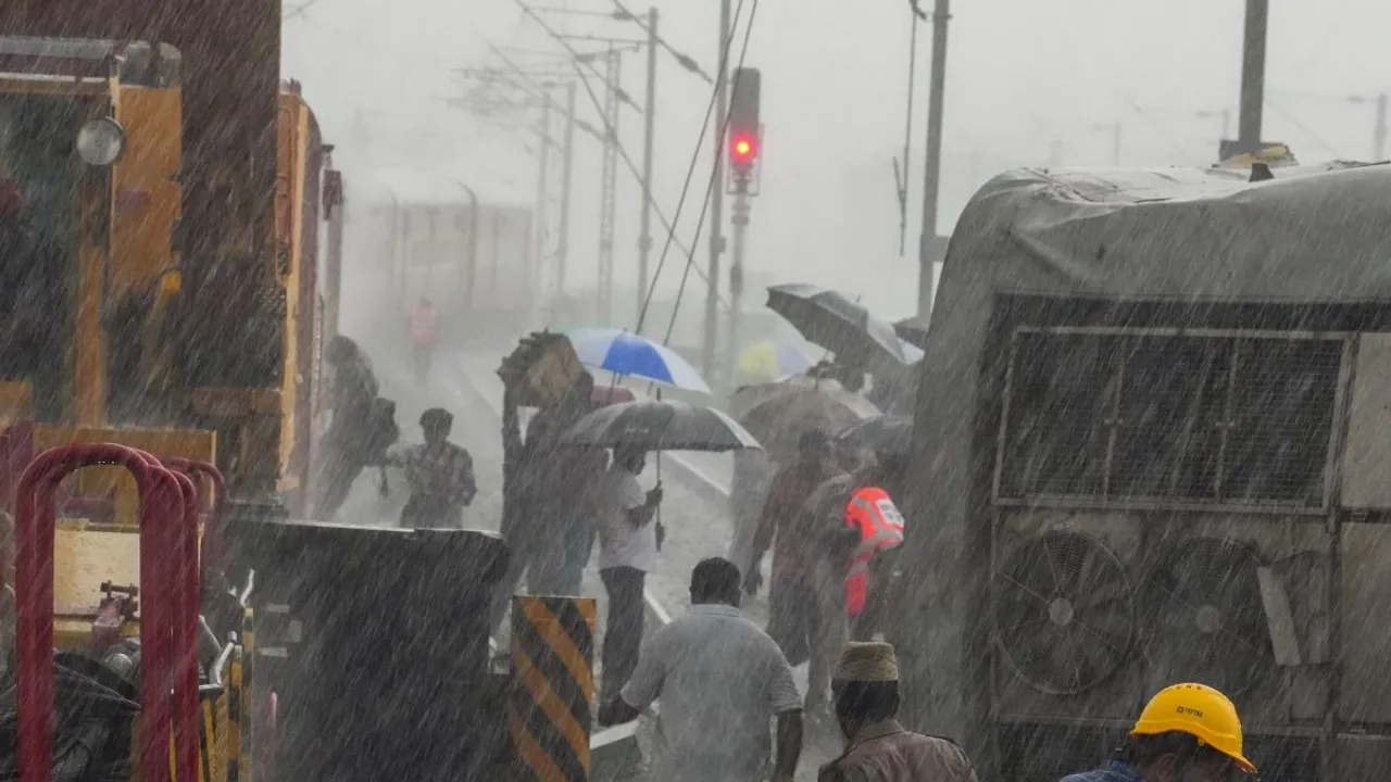 Restoration work underway after Mysuru-Darbhanga Bagmati Express train rammed into a stationary goods train on Friday, amid rain, at Kavaraipettai near Chennai, Saturday, Oct. 12, 2024