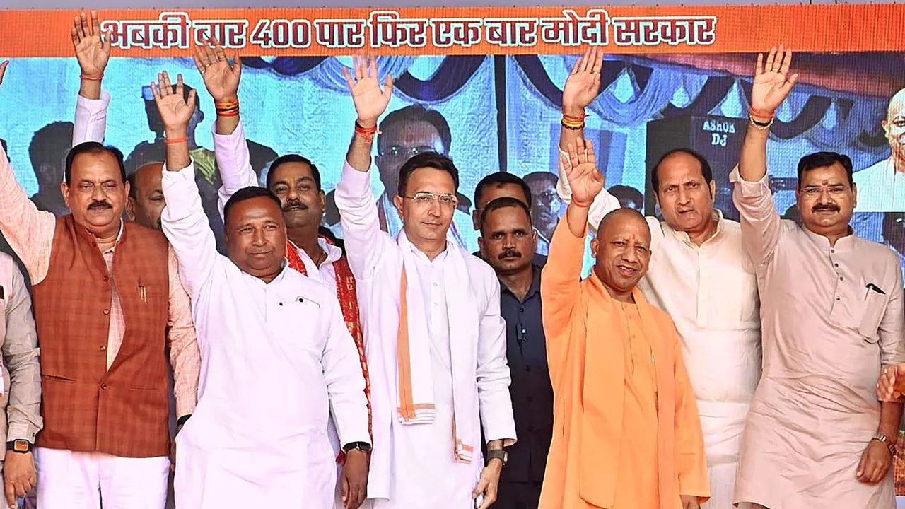 Uttar Pradesh Chief Minister Yogi Adityanath with BJP candidate Jitin Prasada during a 'Prabuddha Varg Sammelan' ahead of upcoming Lok Sabha elections, in Pilibhit, Tuesday, April 2, 2024