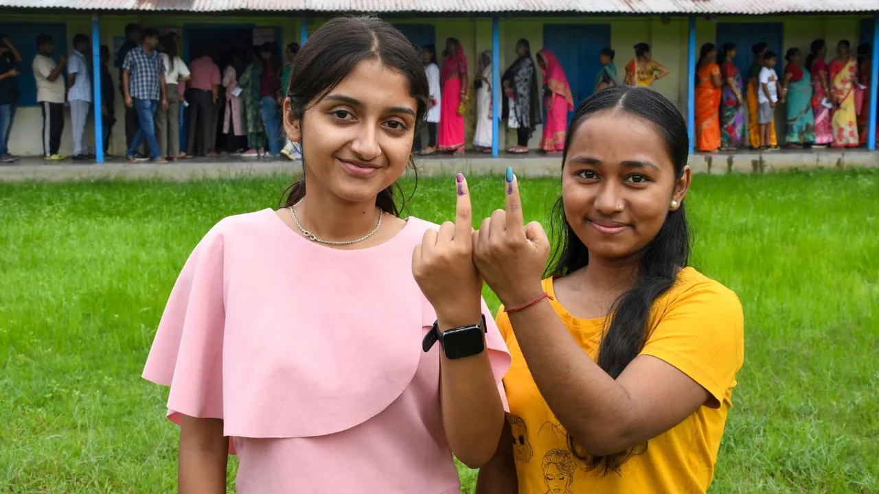 First-time voters show their fingers marked with indelible ink after casting their votes for the first phase of Lok Sabha elections, in Dibrugarh district, Friday, April 19, 2024