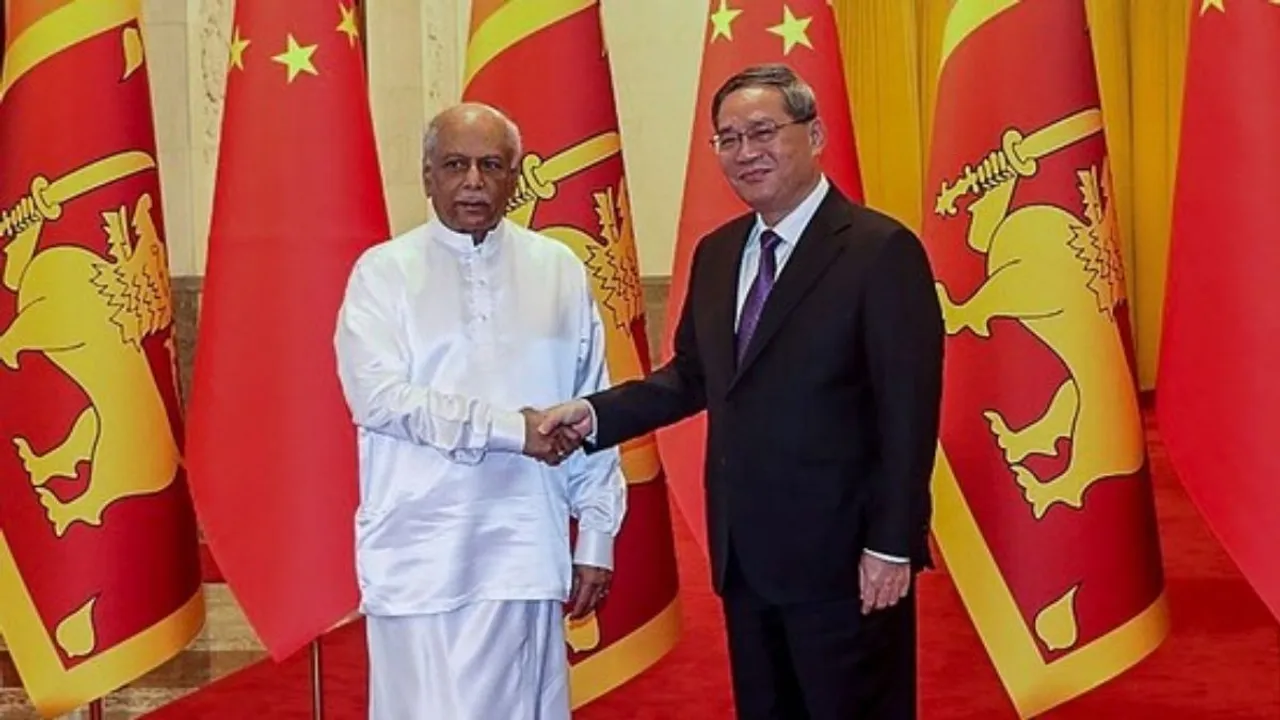 Sri Lanka's Prime Minister Dinesh Gunawardena (L) and China's Premier Li Qiang shake hands before their meeting in Beijing.