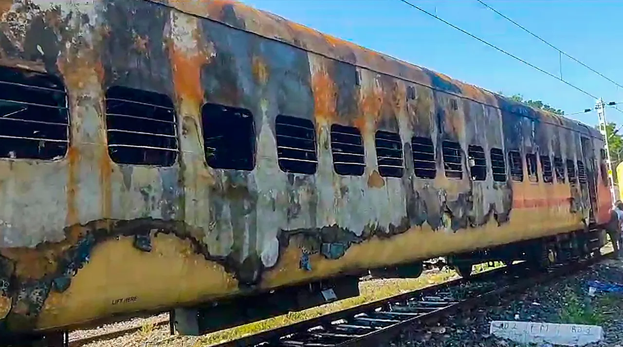 Remains of a train's coach that caught fire at Madurai railway station