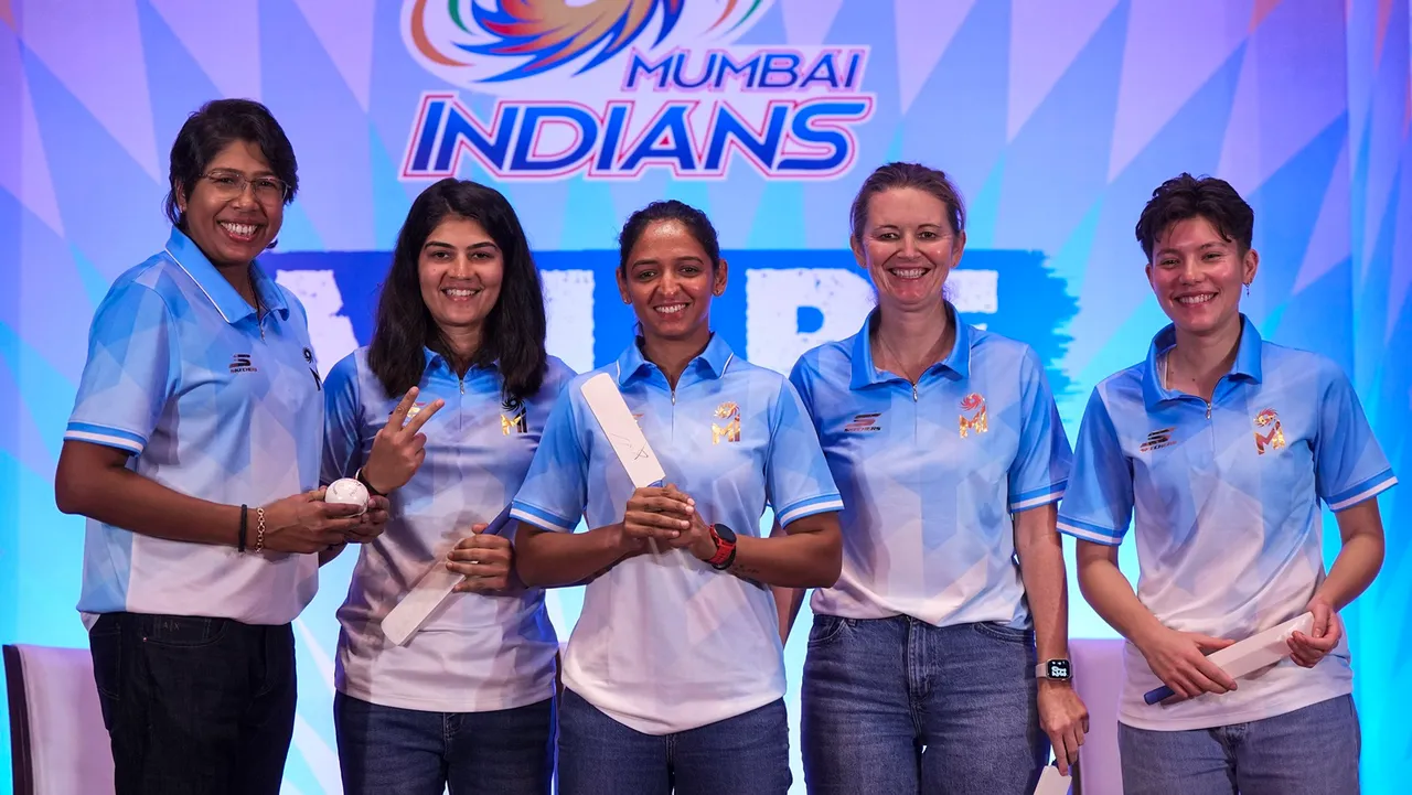 Mumbai Indians (women) team head coach Charlotte Edwards with bowling coach Jhulan Goswami, captain Harmanpreet Kaur and players Yastika Bhatia and Issy Wong during the Mumbai Indians WPL 2024 press conference