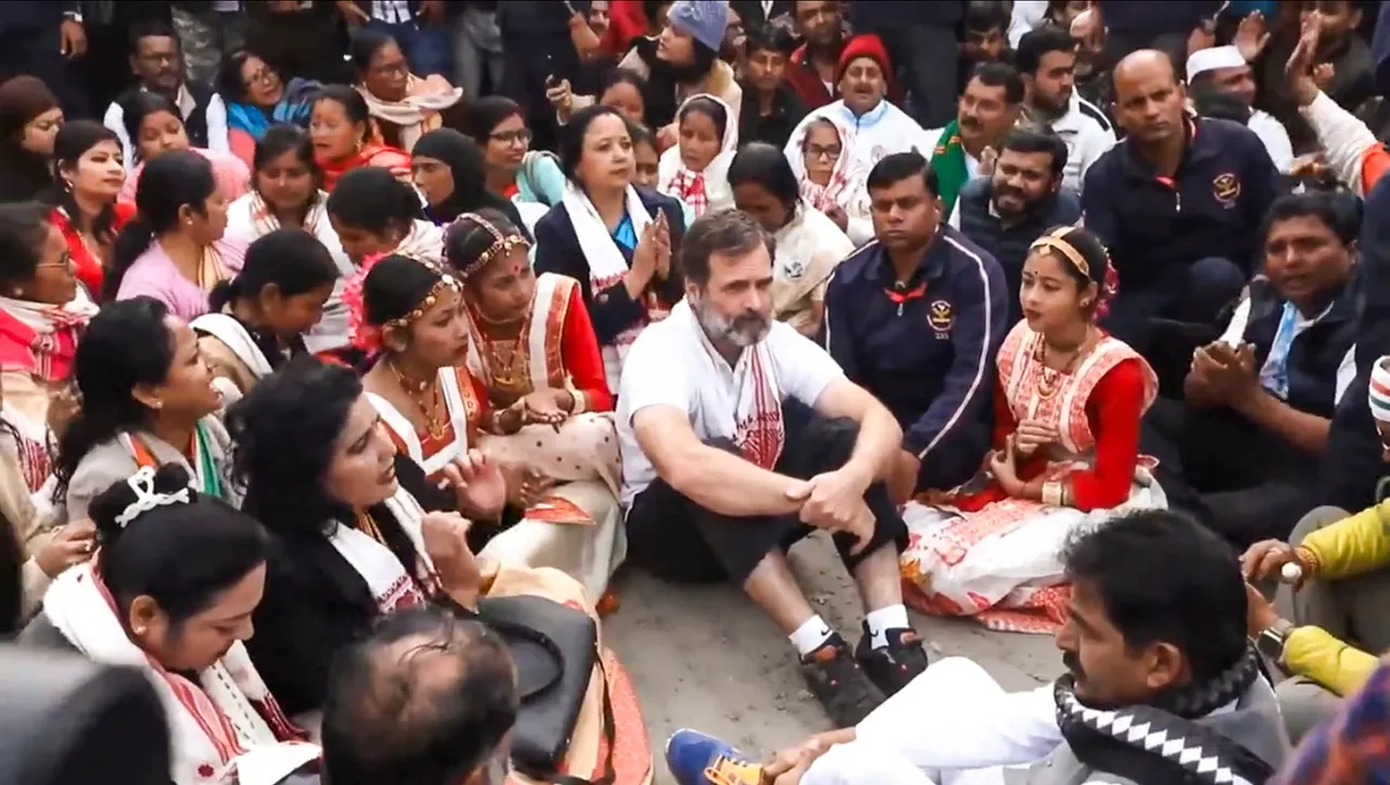 Congress leader Rahul Gandhi with party leaders and supporters sits in protest after he was not allowed to visit the Sri Sri Sankar Dev Satra during the Bharat Jodo Nyay Yatra