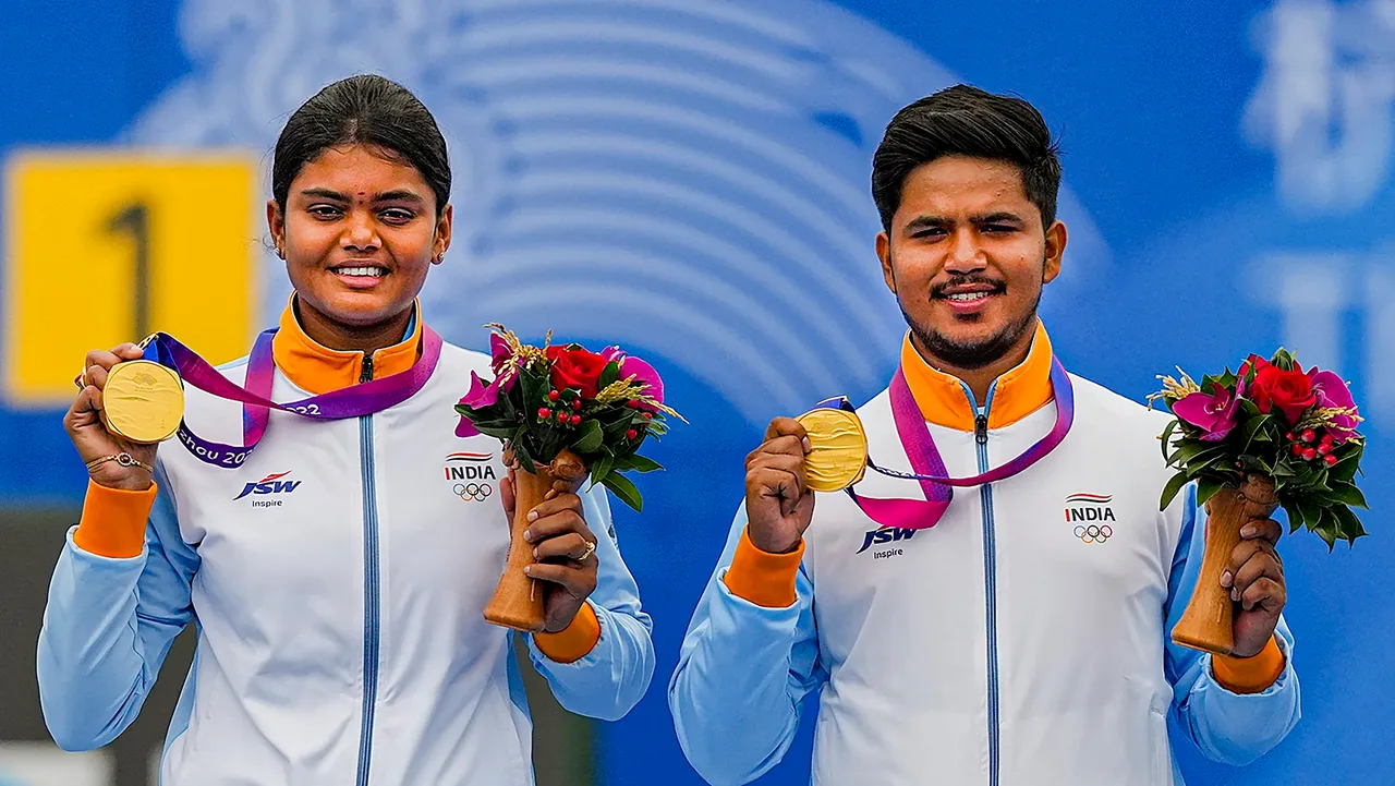 Gold medal winner India's Ojas Pravin Deotale and Jyothi Surekha Vennam on the podium during the medal ceremony of mixed team compound archery event at the 19th Asian Games