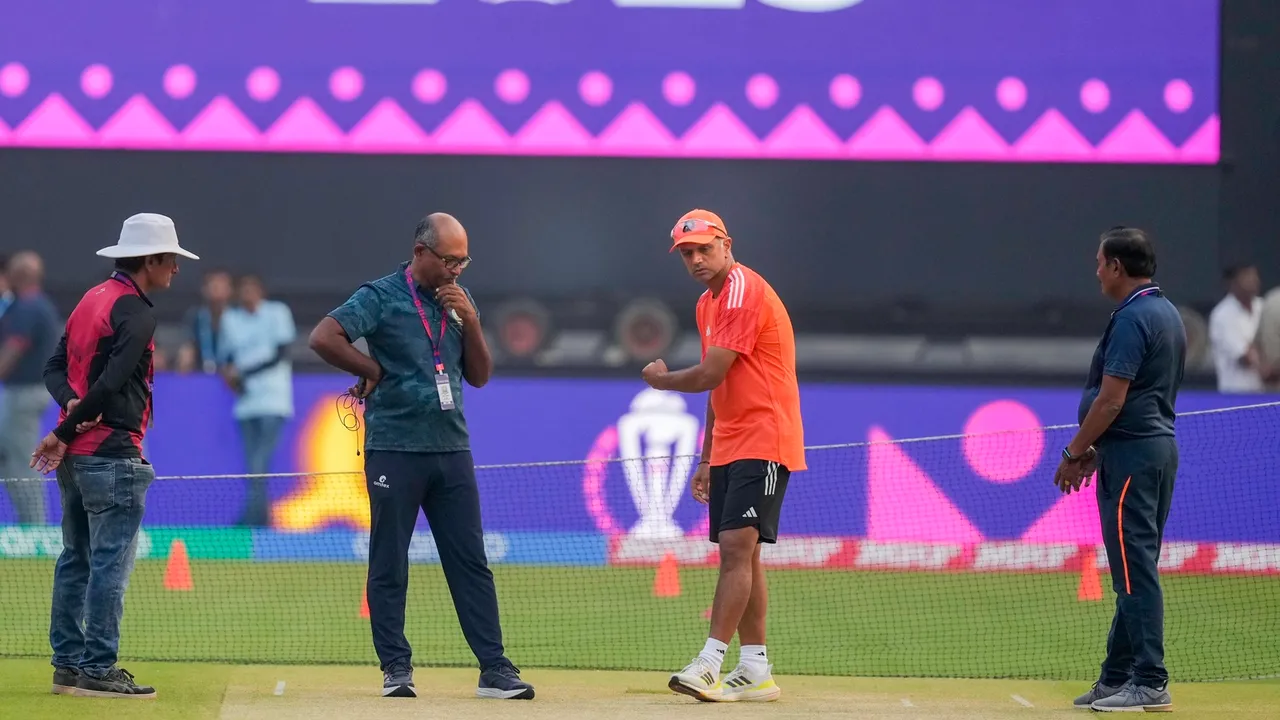 India's head coach Rahul Dravid and others inspect the pitch during a practice session ahead of the ICC Men’s Cricket World Cup 2023’s final match