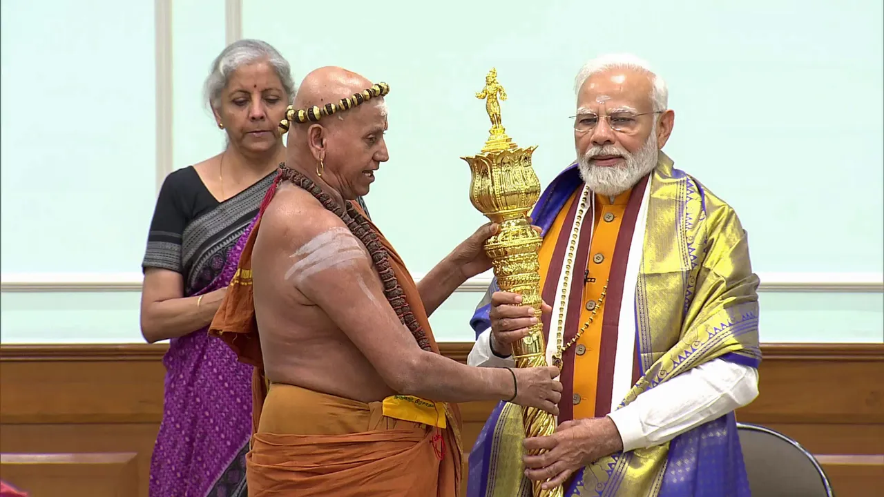 Prime Minister Narendra Modi receives 'Sengol' from an Adheenam on eve of new Parliament building inauguration, in New Delhi