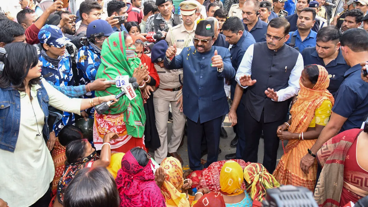 West Bengal Governor CV Ananda Bose interacts with women protestors at Sandeshkhali block, in North 24 Parganas district, Monday, Feb. 12, 2024.