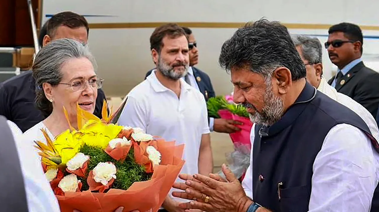 Congress Parliamentary Party Chairperson Sonia Gandhi being welcomed by Karnataka Deputy Chief Minister DK Shivakumar upon her arrival at HAL airport ahead of the united opposition meeting, in Bengaluru, Monday, July 17, 2023. Congress leader Rahul Gandhi is also seen