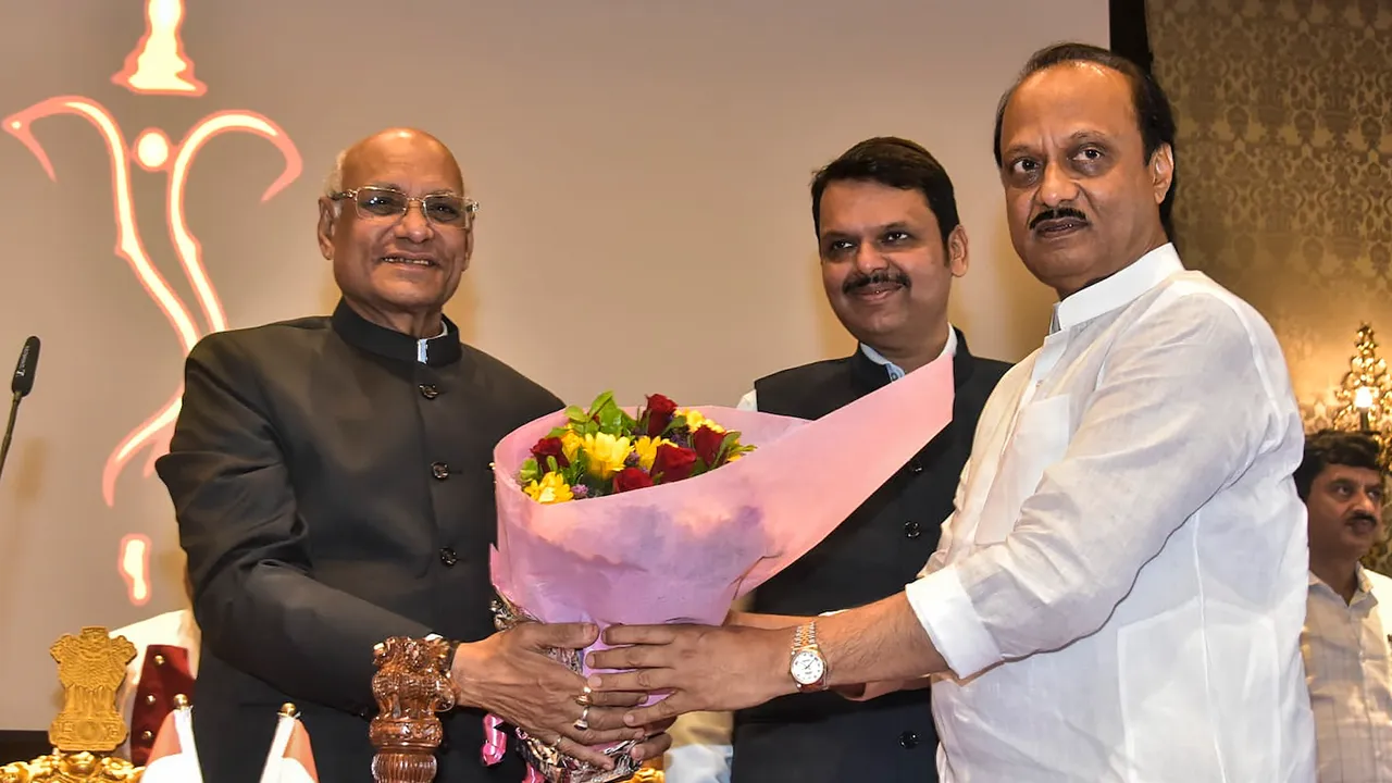 Maharashtra Governor Ramesh Bais greets the newly-sworn in Deputy Chief Minister Ajit Pawar after administering him oath of office, at Raj Bhavan in Mumbai, Sunday, July 2, 2023. Maharashtra Deputy Chief Minister Devendra Fadnavis is also seen