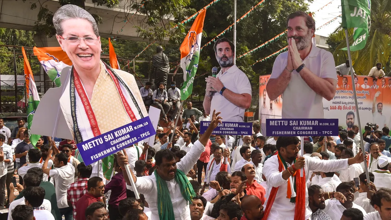 Congress workers and supporters celebrate the party's lead during counting of votes for Telangana Assembly elections, outside Gandhi Bhavan in Hyderabad