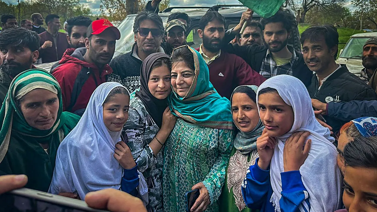 Peoples Democratic Party (PDP) President Mehbooba Mufti with supporters during an election rally ahead of Lok Sabha polls, in Kulgam, Wednesday, April 17, 2024