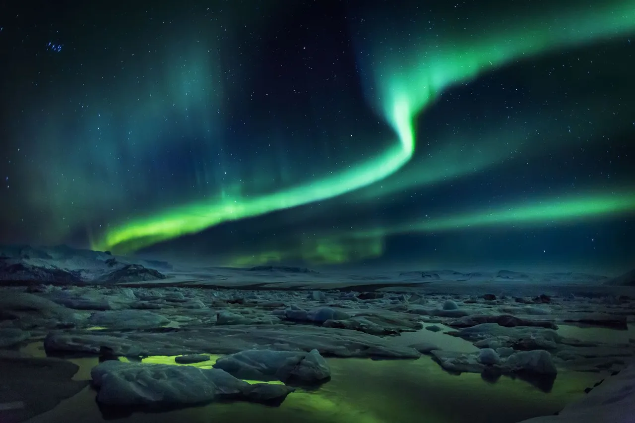 What are auroras, and why do they come in different shapes and colors?