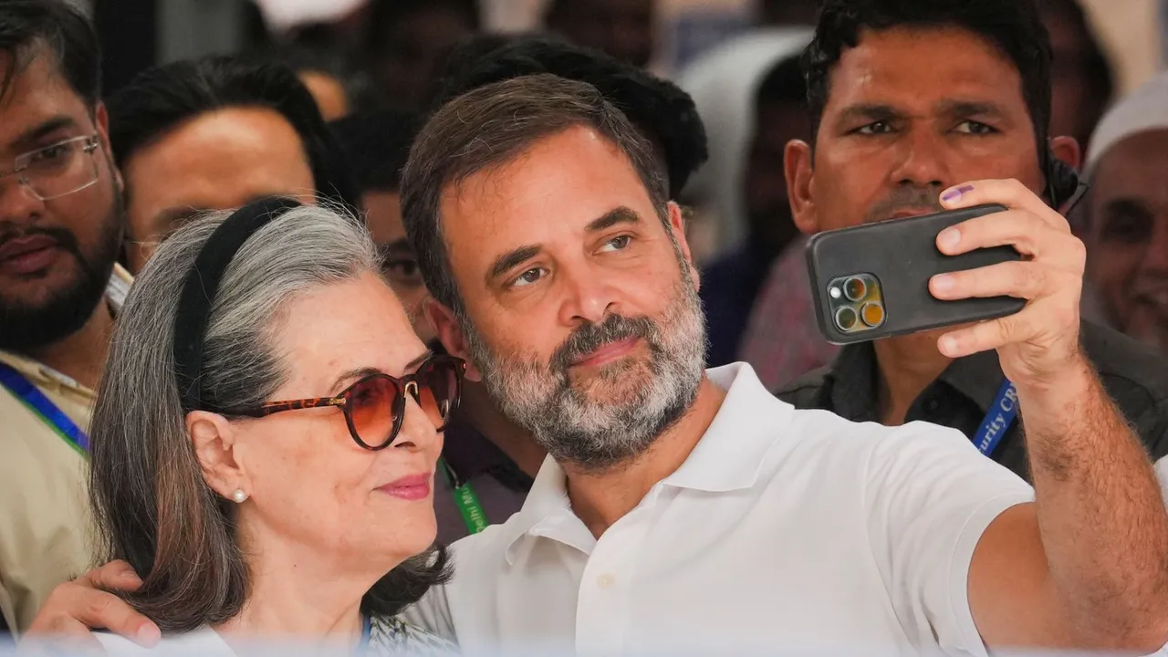 Congress leader Rahul Gandhi clicks a selfie with his mother Sonia Gandhi after casting his vote at a polling booth during the sixth phase of Lok Sabha elections, in New Delhi, Saturday, May 25, 2024