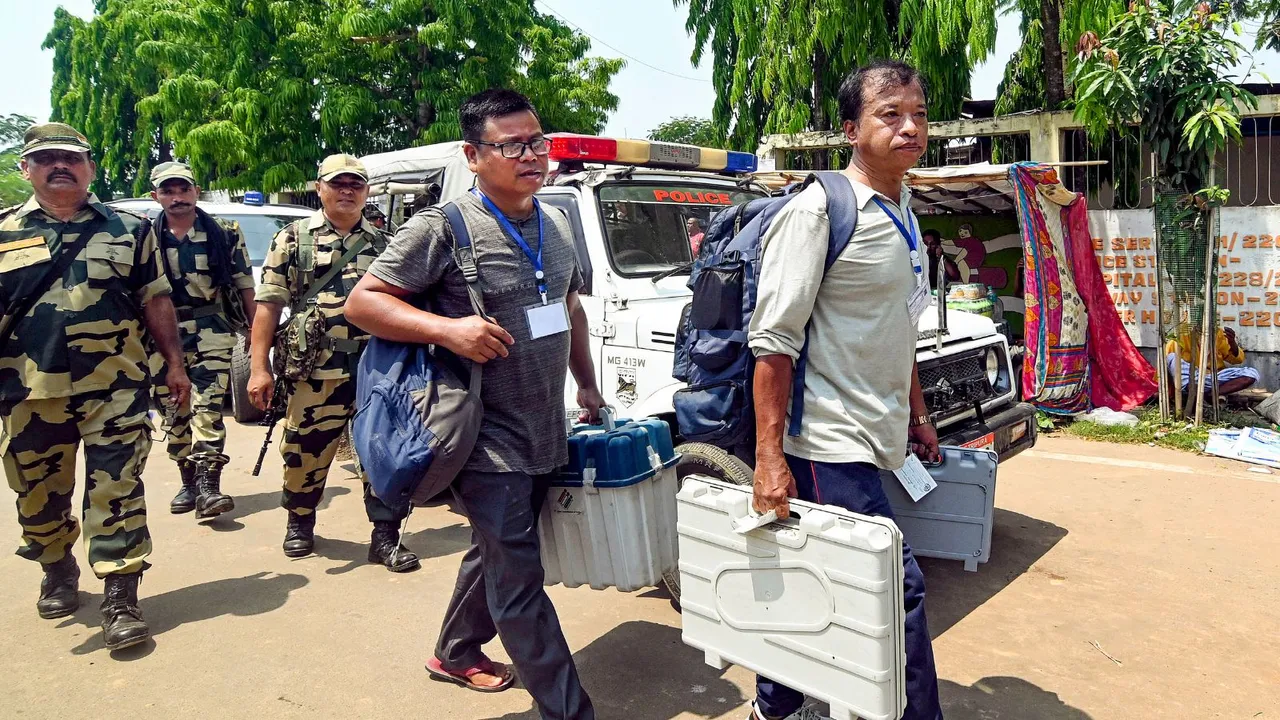 Polling officials leave for election duty on the eve of the 2nd phase of Lok Sabha polls in Tripura