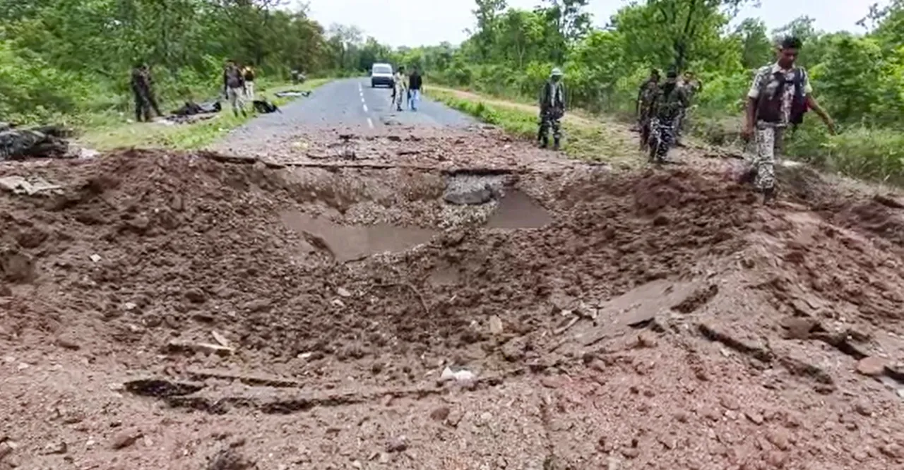 Security personnel at the site after at least ten police personnel and a driver were killed in a blast carried out by Naxalites in Chhattisgarh's Dantewada district