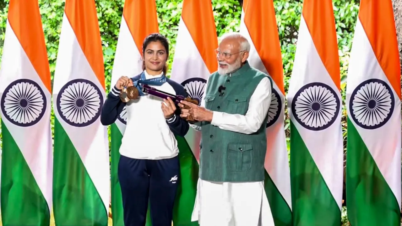 Prime Minister Narendra Modi with bronze medallist shooter Manu Bhaker during his interaction with the Indian contingent for Paris Olympics, in New Delhi, Thursday, Aug. 15, 2024