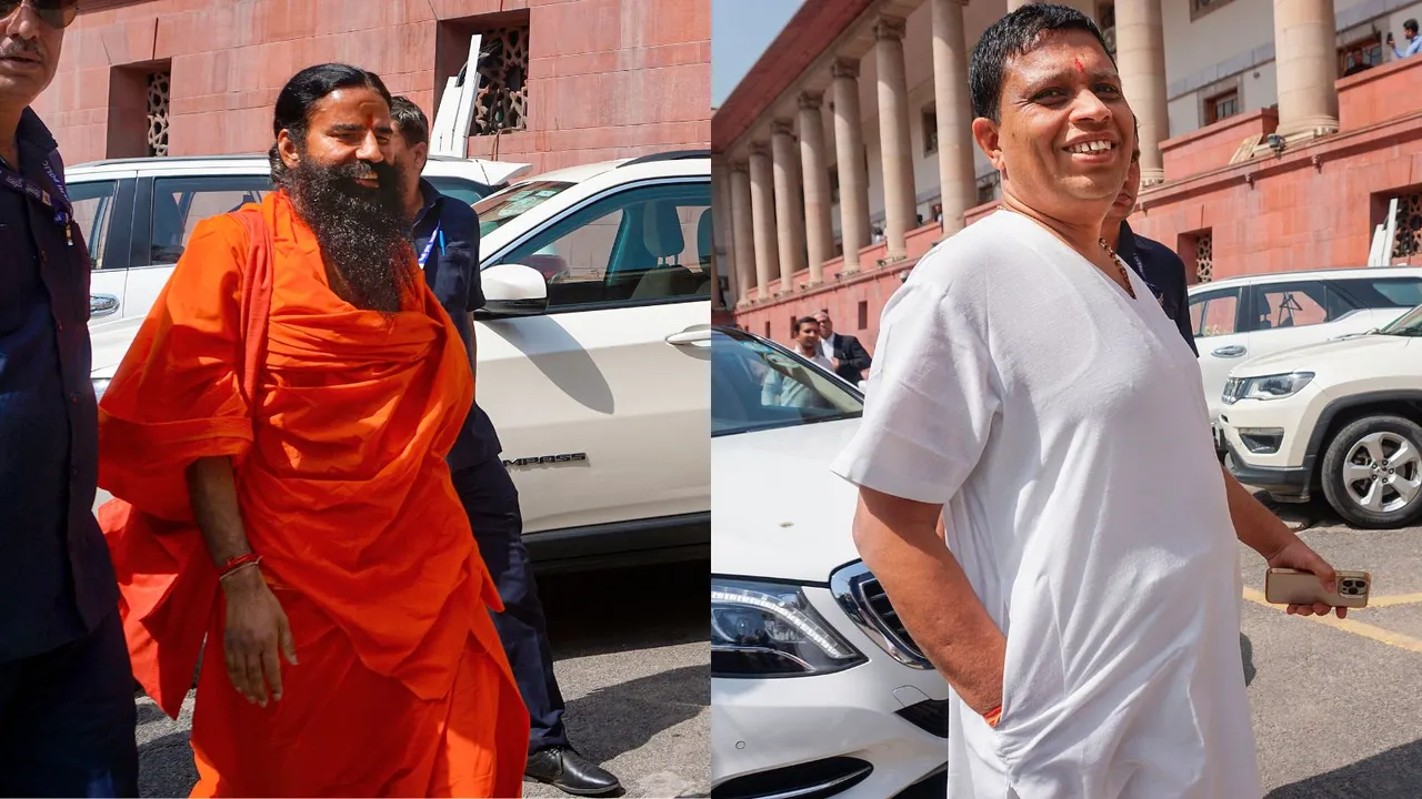 Baba Ramdev (L) and Acharya Balkrishna (R) arrives at the Supreme Court for a hearing on the Patanjali misleading advertisements case, in New Delhi, Tuesday, April 23, 2024